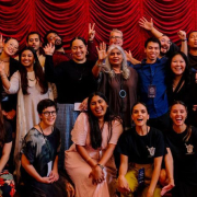 PASC Episode One Web Series Pilot Programme Episode One participants, Shuchi Kothari, and Dale Corlett stand in front of a red curtain and PASC banner