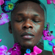 Stylebender dir by Zoe McIntosh Israel Adesanya lays with eyes closed in a bath sprinkled with flower petals